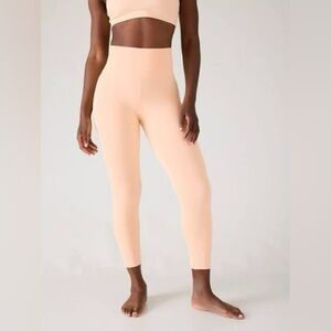 Athleta Ultra High Rise Elation 7/8 tight in Carnation Peach. Size medium.